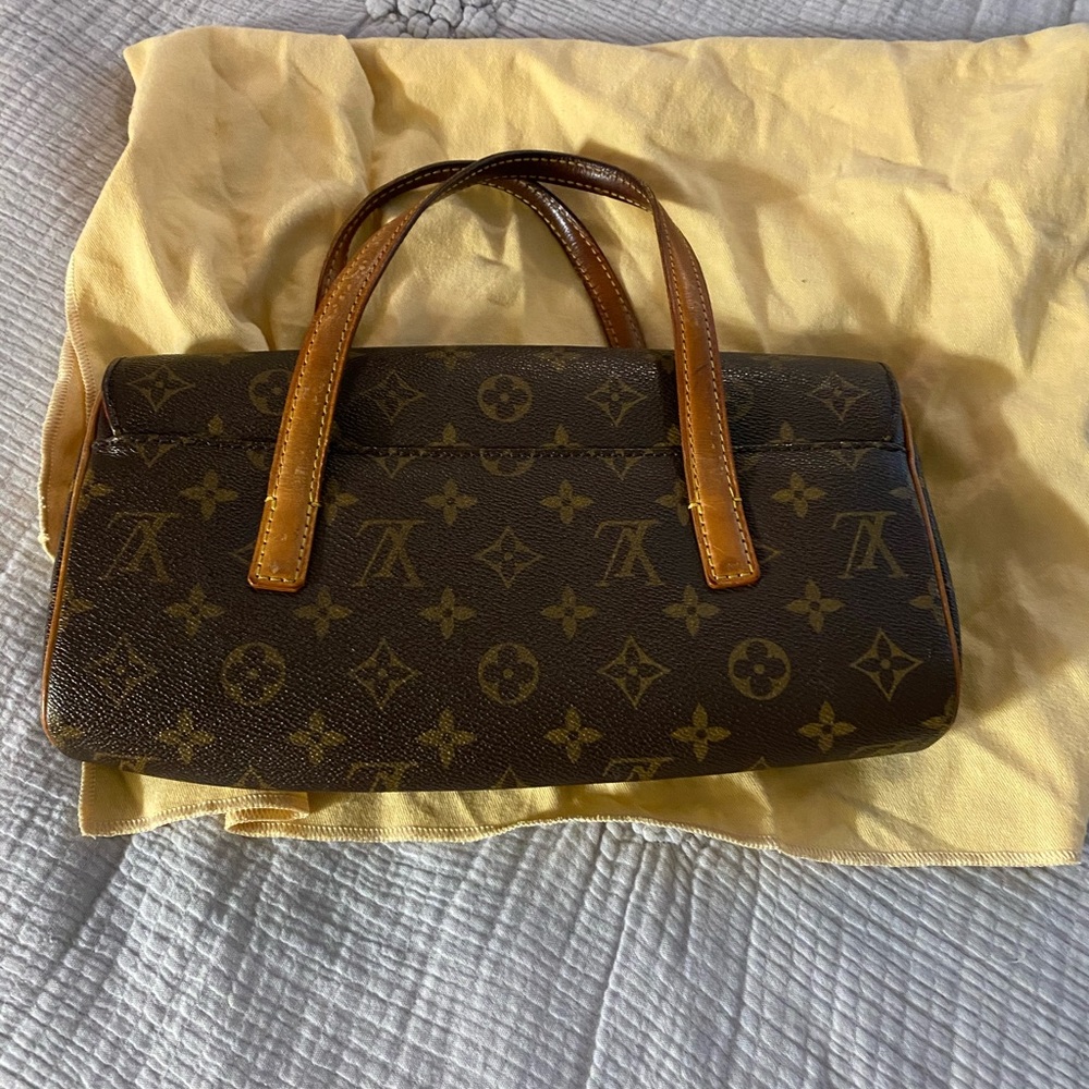 Louis Vuitton top handle clutch